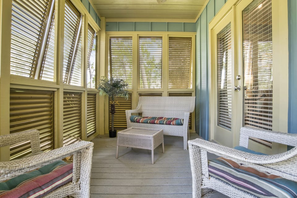 Cozy front porch is just off the master bedroom.