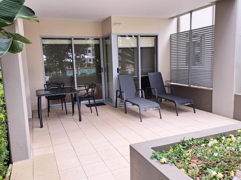Part of the terrace overlooking the Lagoon Pool with a Sandy Beach