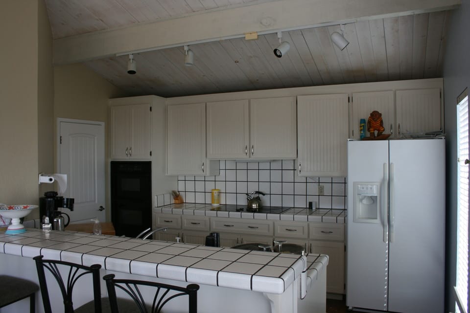 Big, bright and clean kitchen. Enjoy views out to Monterey while preparing food