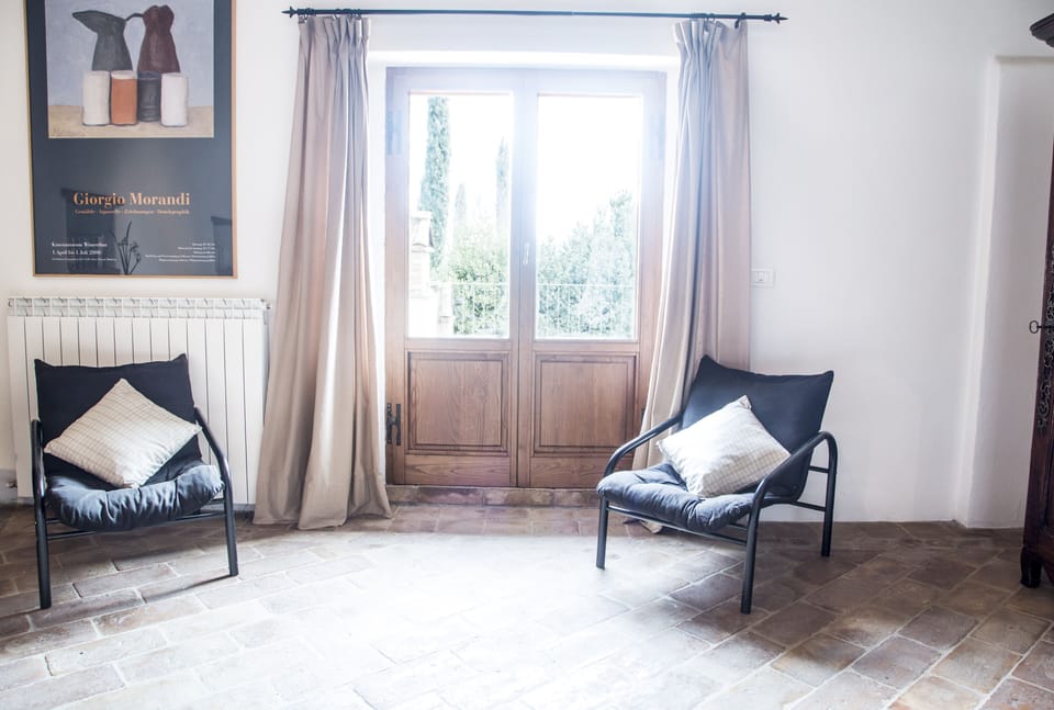 Downstairs sitting room, doors to patio and barbecue area