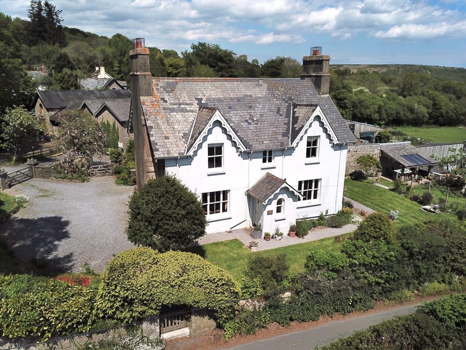 Town Barton, Manaton. Guest car park to the left, walled garden to the right.