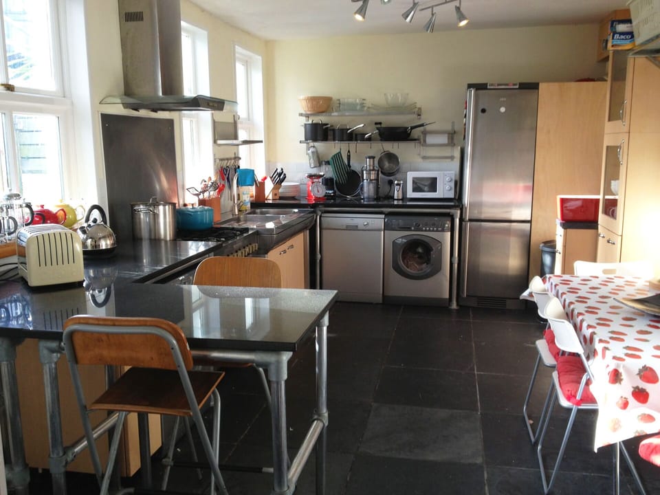 large kitchen showing four seater table 