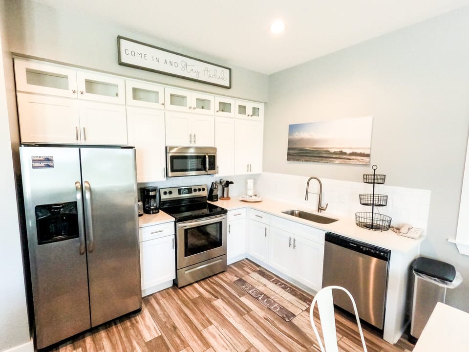 East Point Cottages offers a modern, open floor plan living, kitchen, and dining area