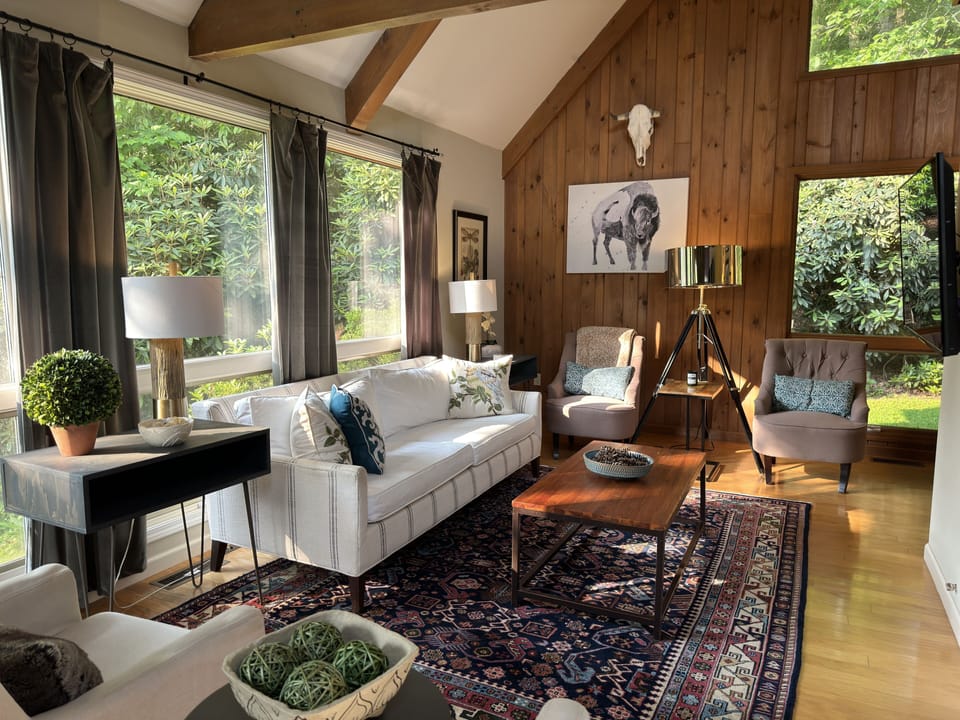 Large vaulted living room with plenty of seating and beautiful views