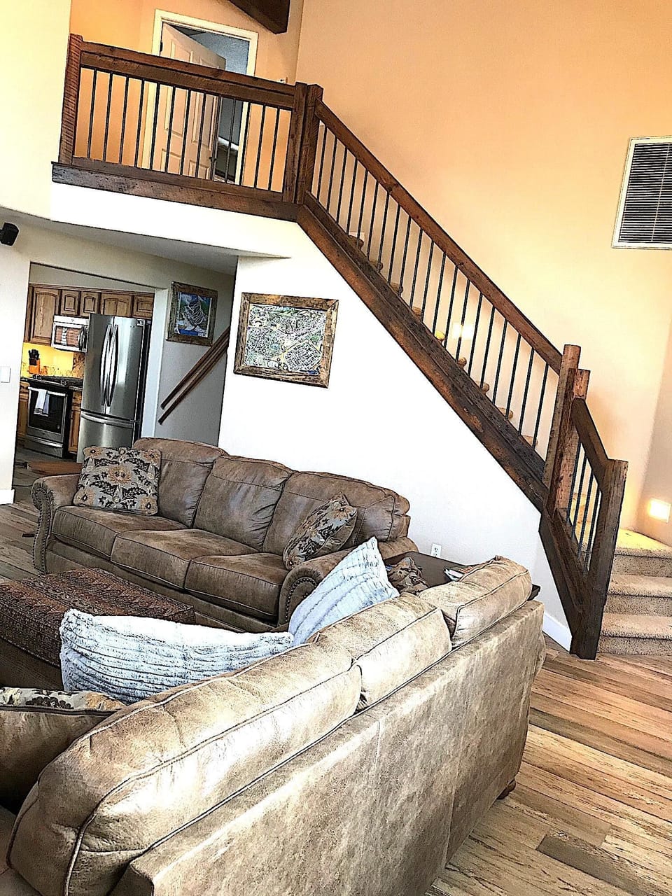 Custom wood rail staircase made from 1800s refinished barn wood. 