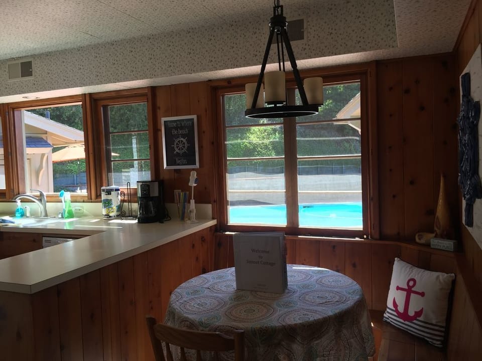 Built in banquette in kitchen...view of pool!  