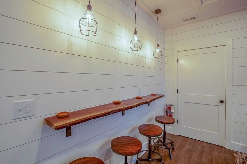 Wooden bar and seating near the pool table