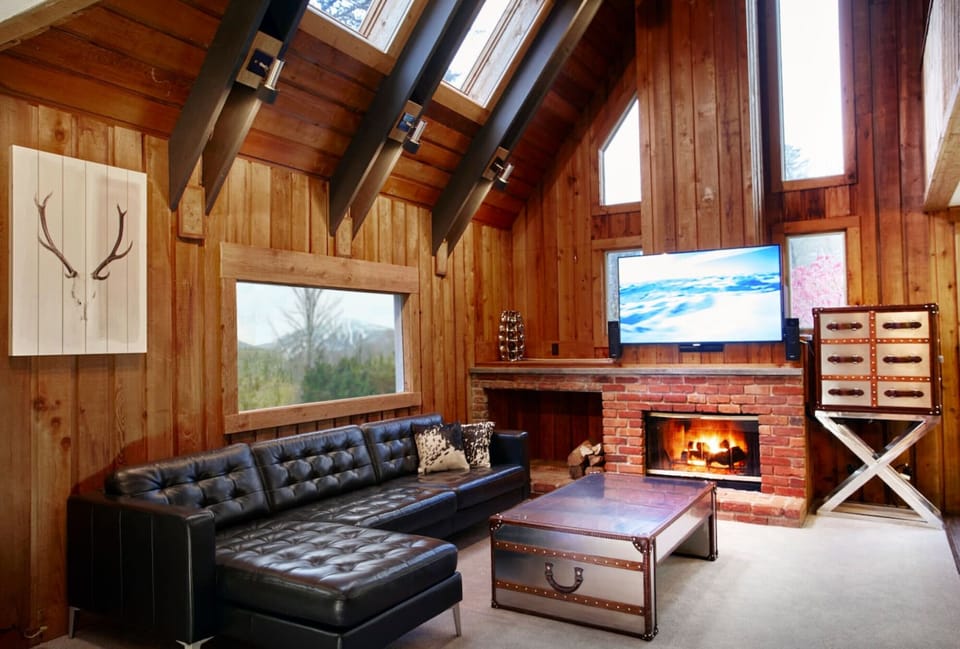 spacious living room with smart tv home theater and fireplace. Views of Stratton