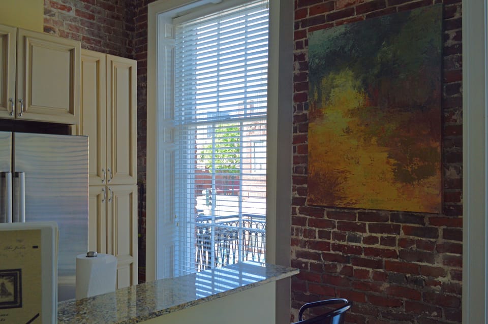 Original exposed brick walls, floor to ceiling windows