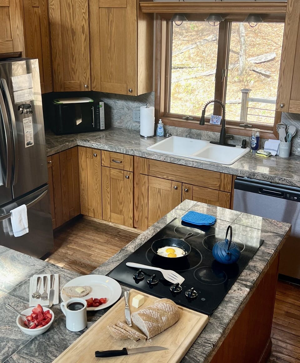 The kitchen features new cabinets. 