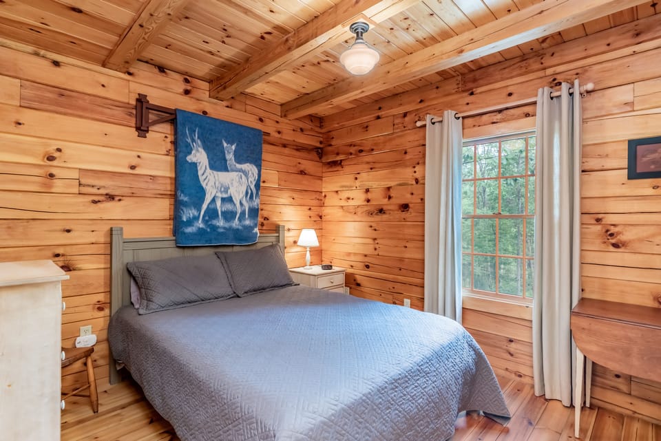 1 of 2 downstairs (closed door) bedrooms.