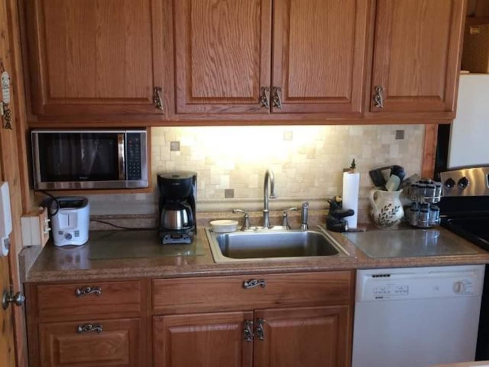 Totally Renovated well equipped Kitchen. Dishwasher, microwave, stove, full refrigerator