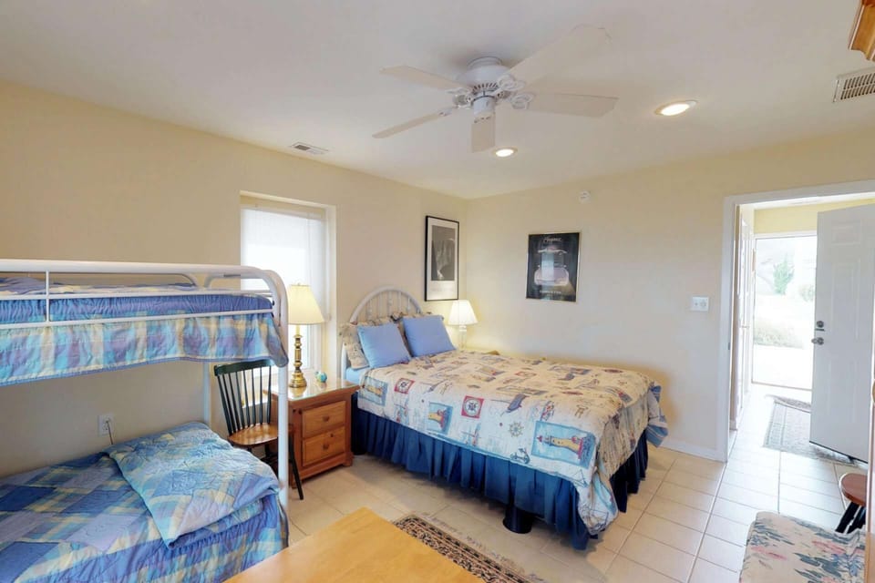 1st floor spacious bedroom with siding doors out to the patio