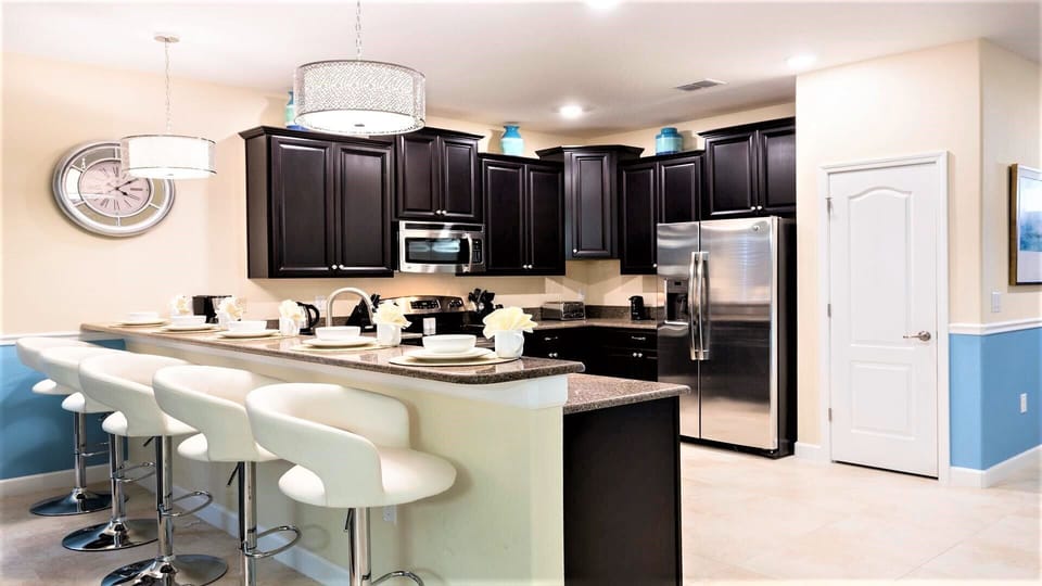 Enjoy meals at the breakfast bar and a fully equipped kitchen for a delightful culinary experience