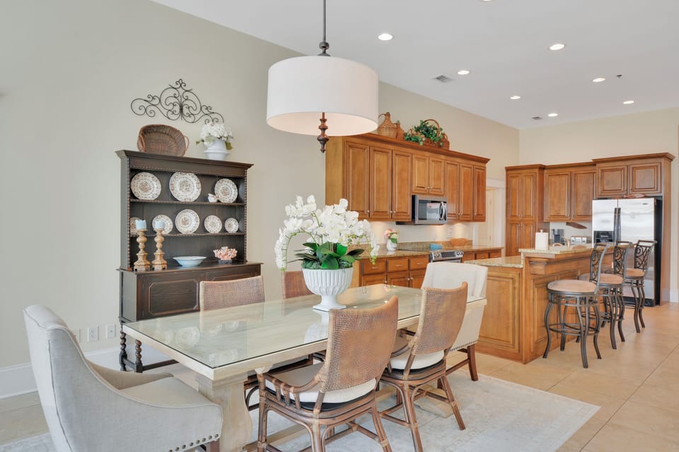 Dining Area Beside the Kitchen - Table seating sits between the windowed sitting area and kitchen, keeping meals close to the main room.