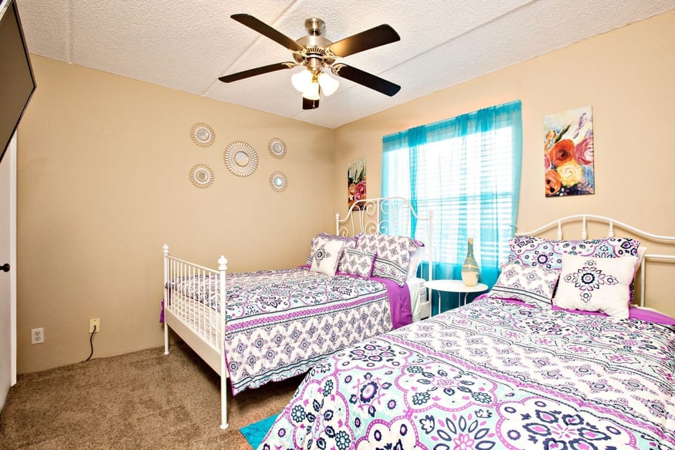 Ceiling fan and a mounted flat screen TV for further enjoyment.