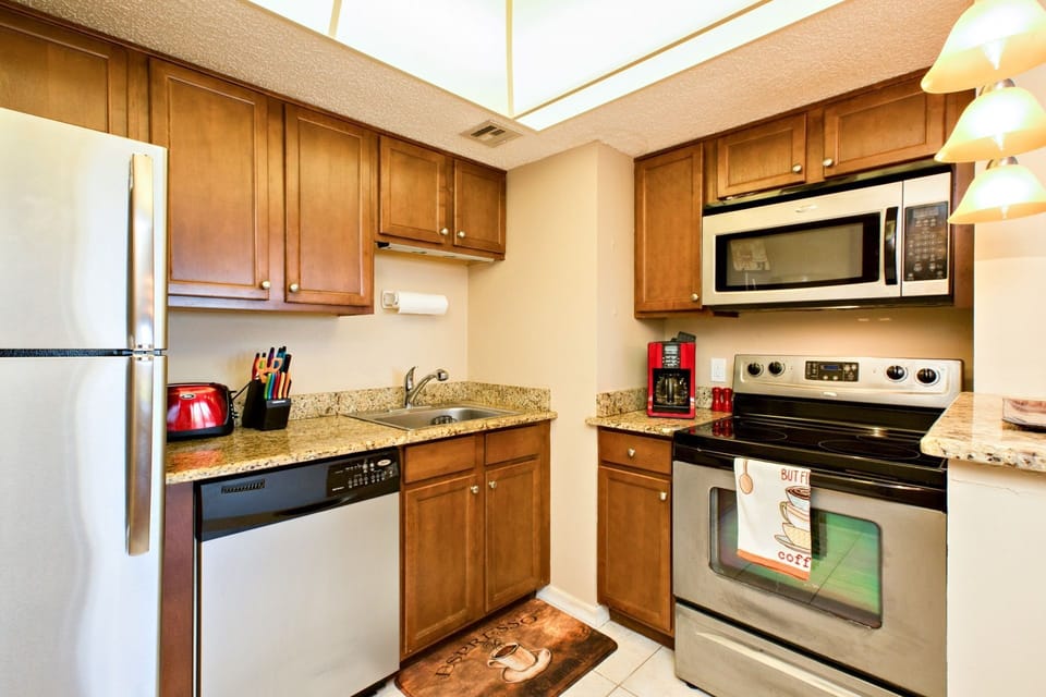 Refrigerator, stove/oven, dishwasher, microwave, coffee pot, toaster, cookware, plates, utensils, etc. available for use.