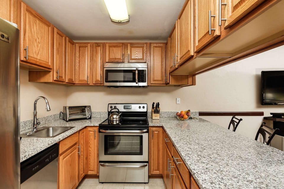 You will enjoy making meals in the fully equipped kitchen with granite countertops and stainless steel appliances.