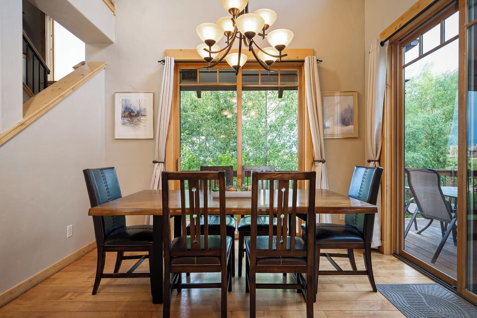 Dining room table with room for six and patio access