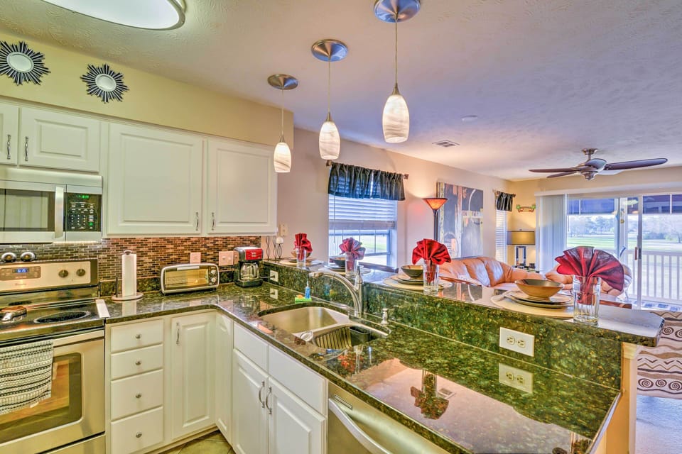 Admire the granite counters and stainless steel appliances.