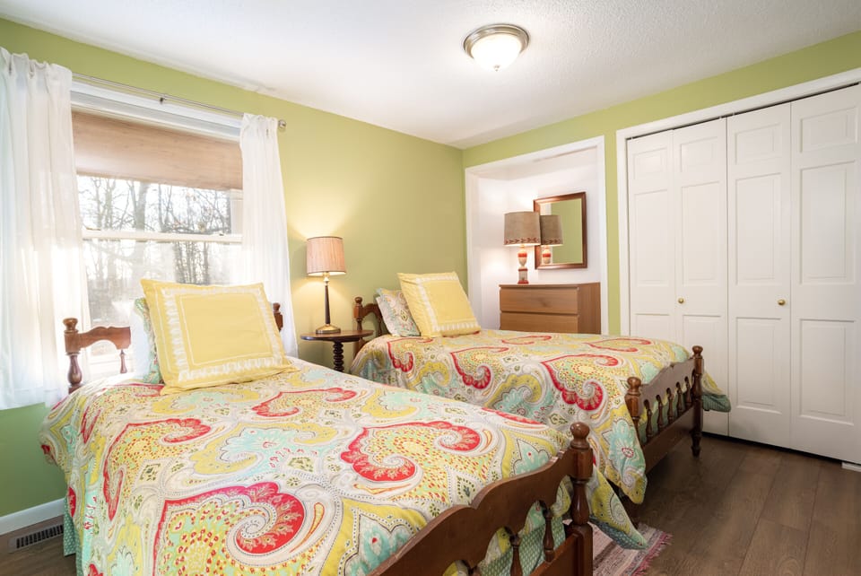 Downstairs twins bedroom offers twin beds with high quality mattresses