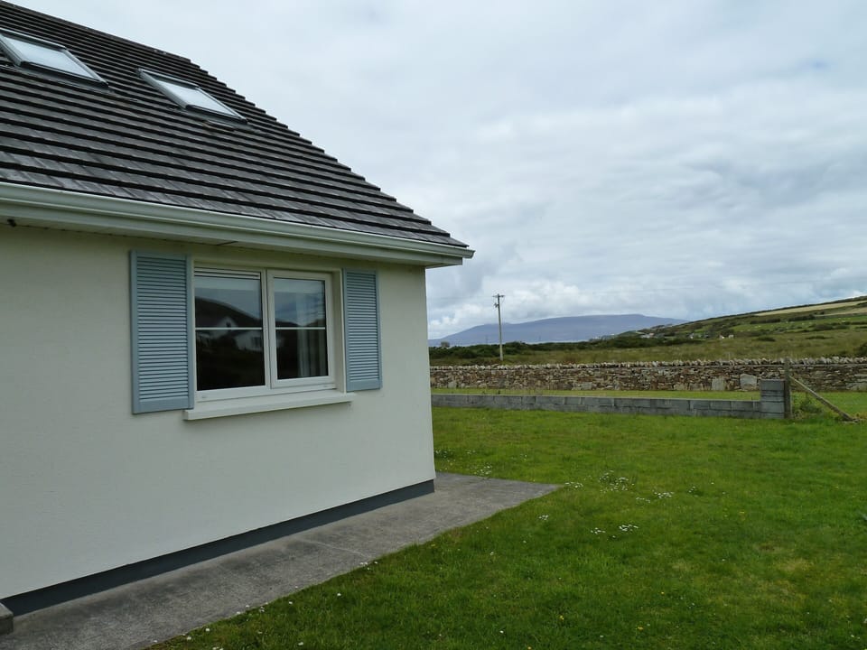 Rear view of cottage and side garden