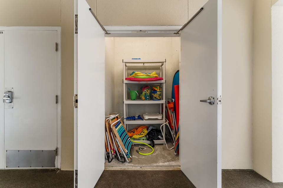 Beach chair and toys closet with its own hose right outside our unit!