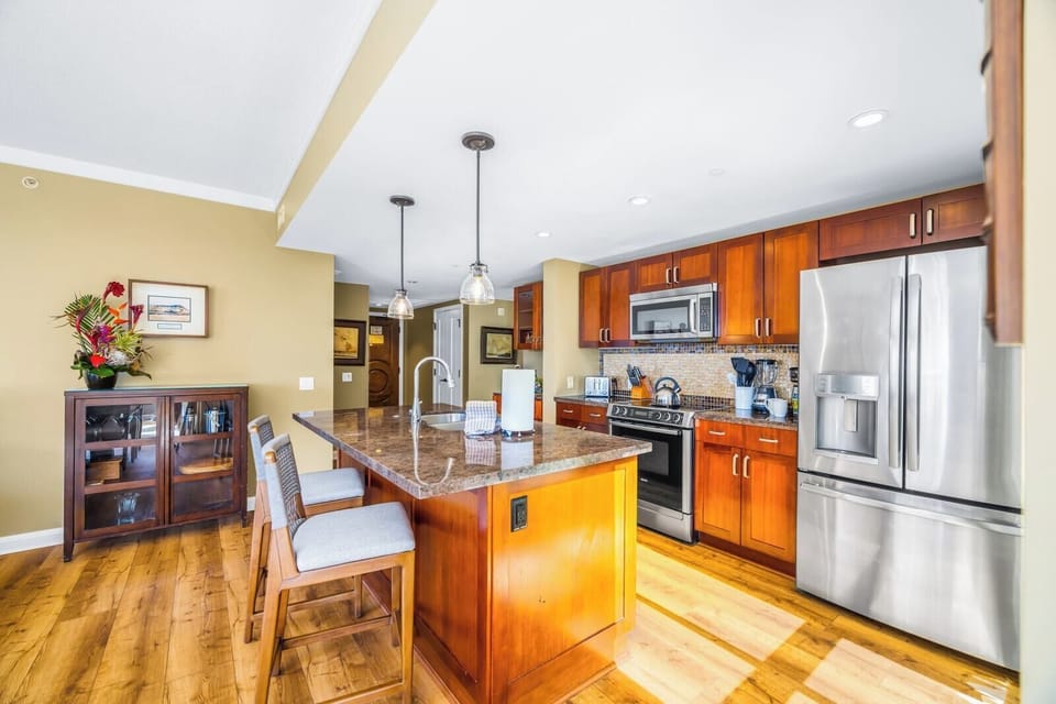 Your fully equipped kitchen features granite counters, stainless steel appliances, and everything you need for home-cooked meals.