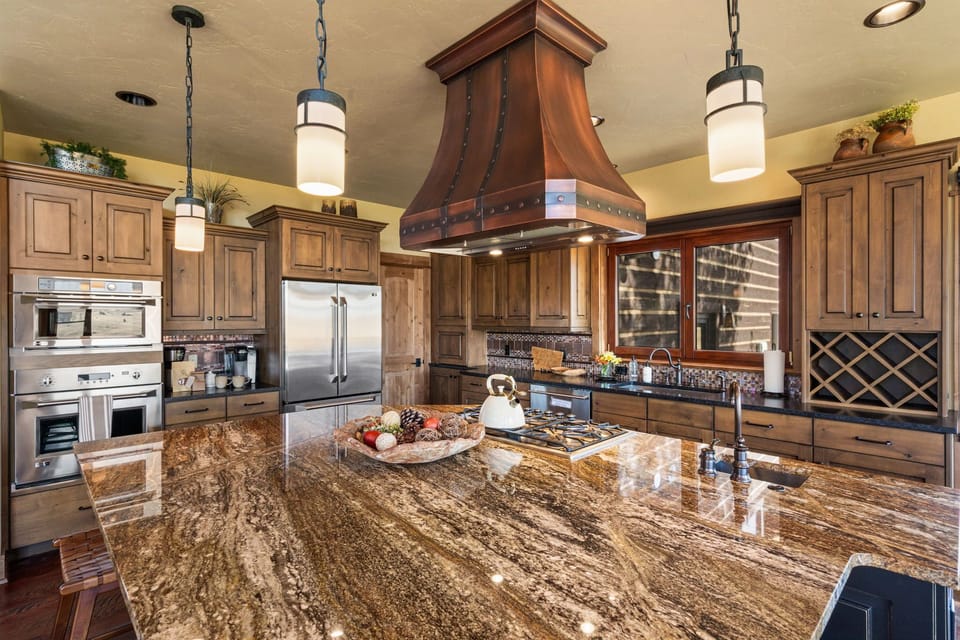 A massive chef's style kitchen with modern applianaces and amenities.  Fully stocked for your dining and culinary adventures.