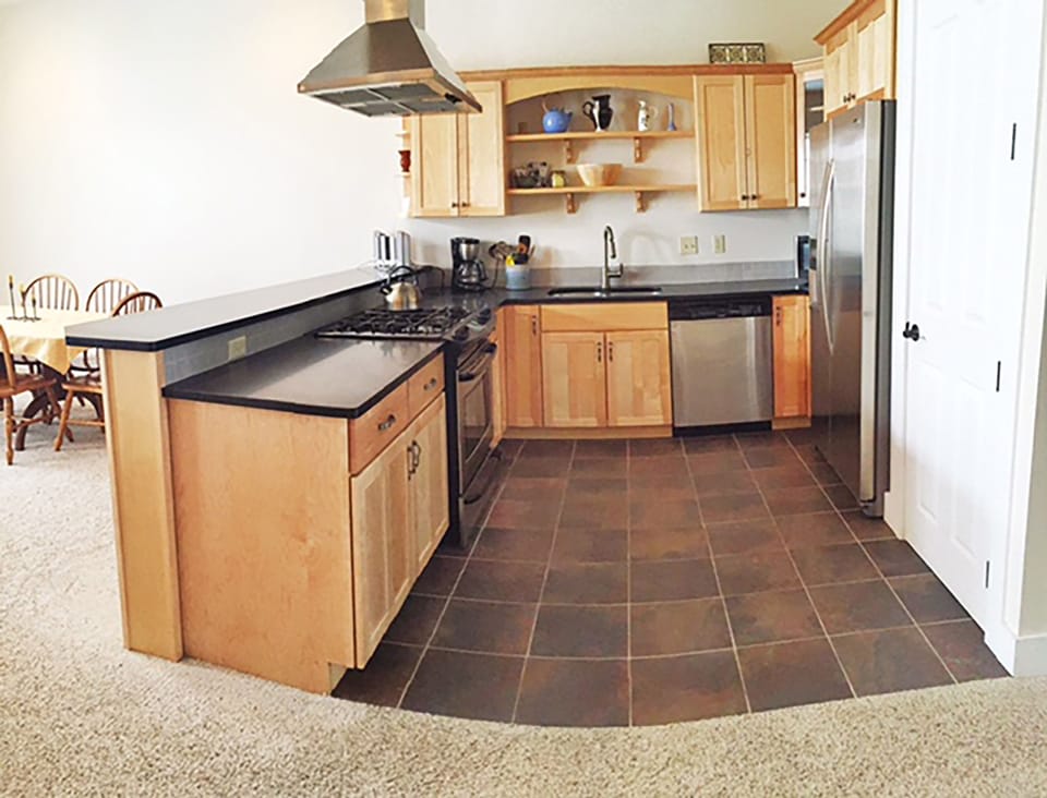 Kitchen is spacious and fully stocked.