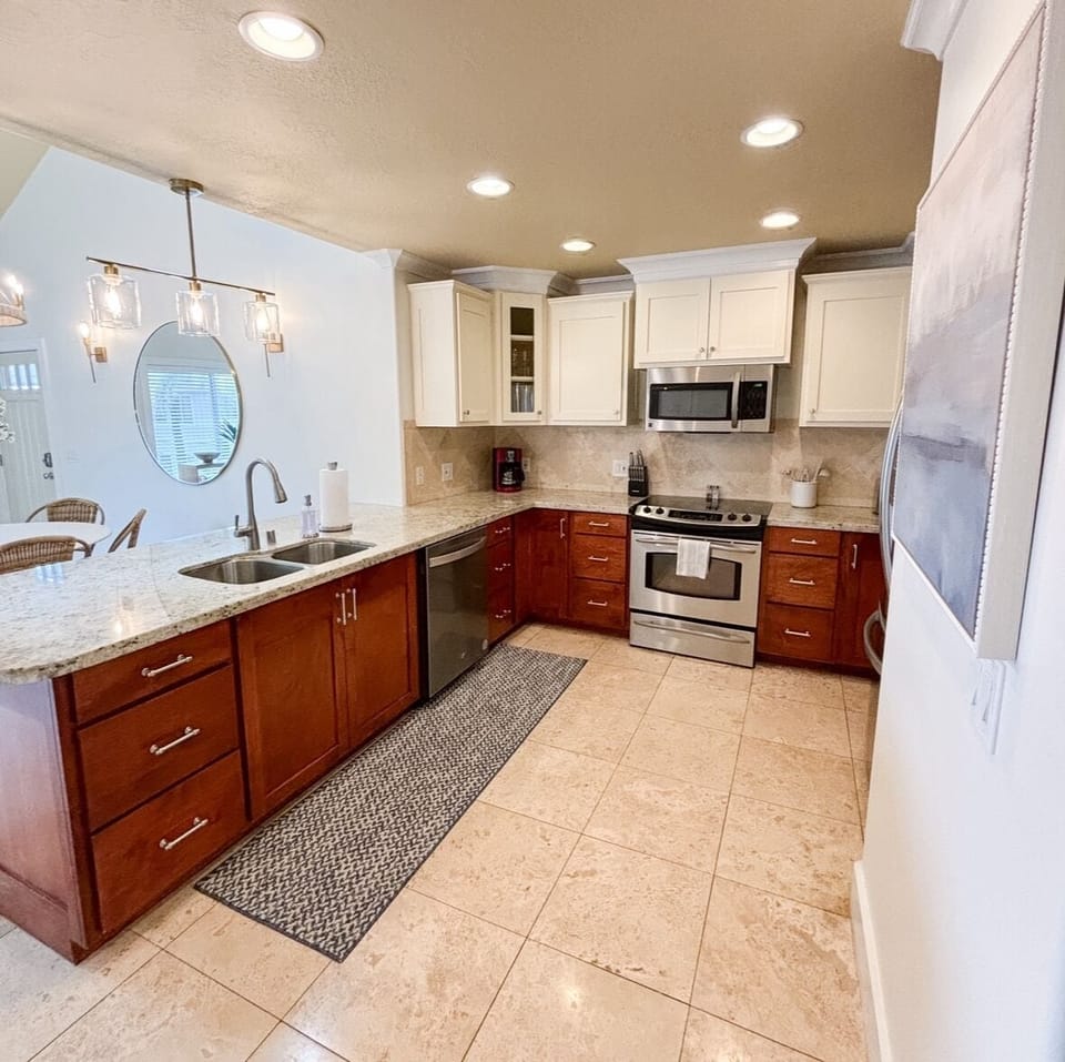 Freshly refinished kitchen cabinets and granite countertops