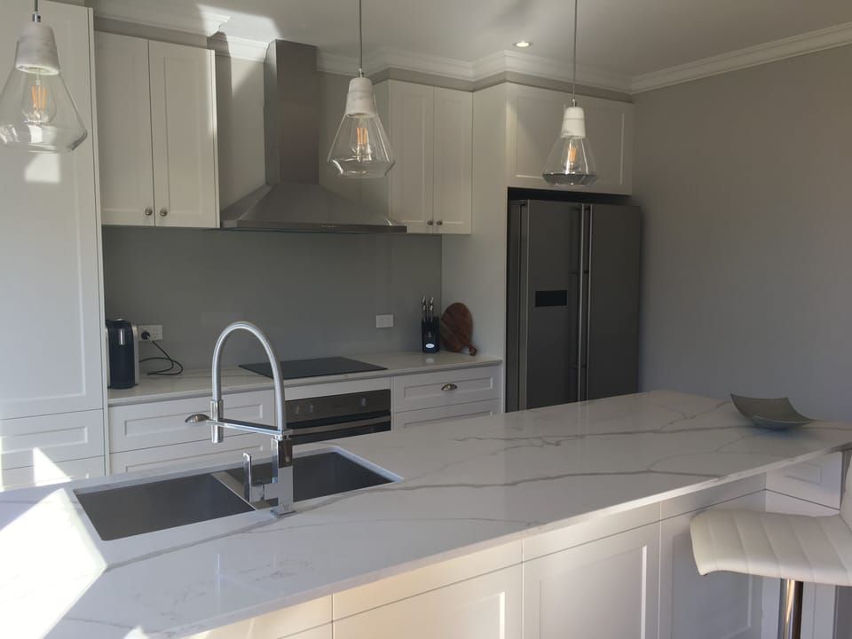 Kitchen featuring Stone bench tops