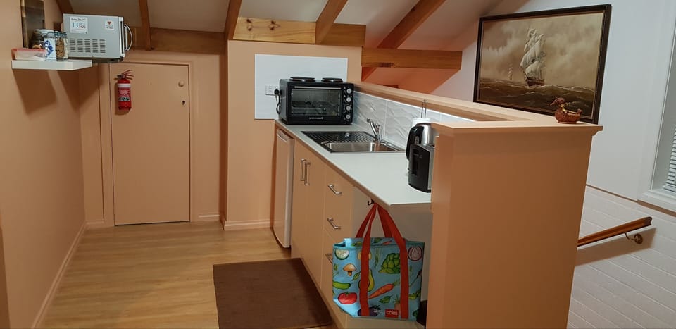 kitchen  oven bench plates fridge toaster jug fry pan  sandwich press microwave 