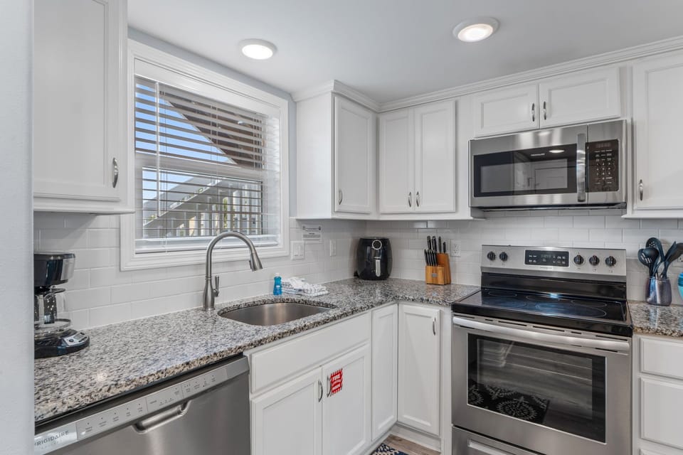 Your fully-equipped kitchen features granite countertops, stainless steel appliances, and everything you need to create memorable meals during your stay.