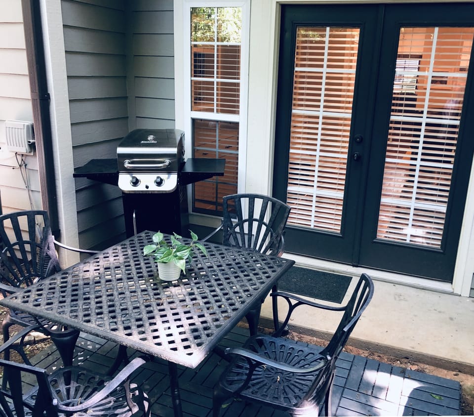 Gas grill and seating for 4 on the back patio