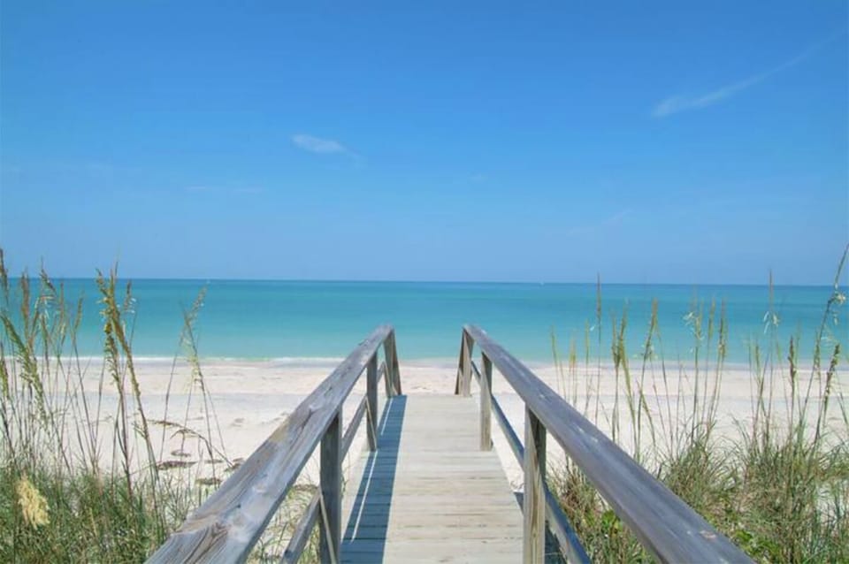 Lido beach w/ fine white sand and clear turquoise water