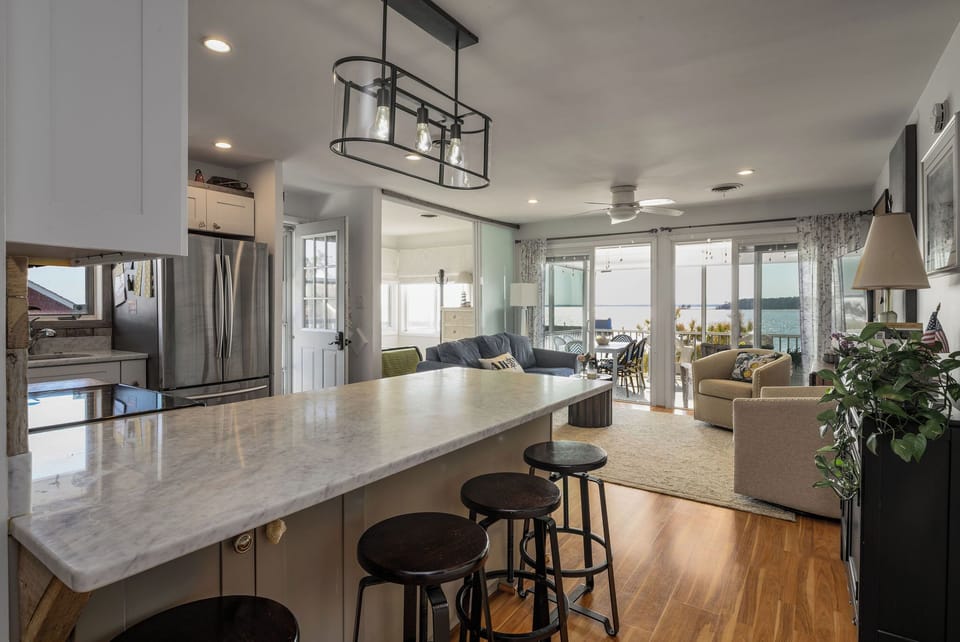 breakfast bar and view of living area porch and Rehoboth bay