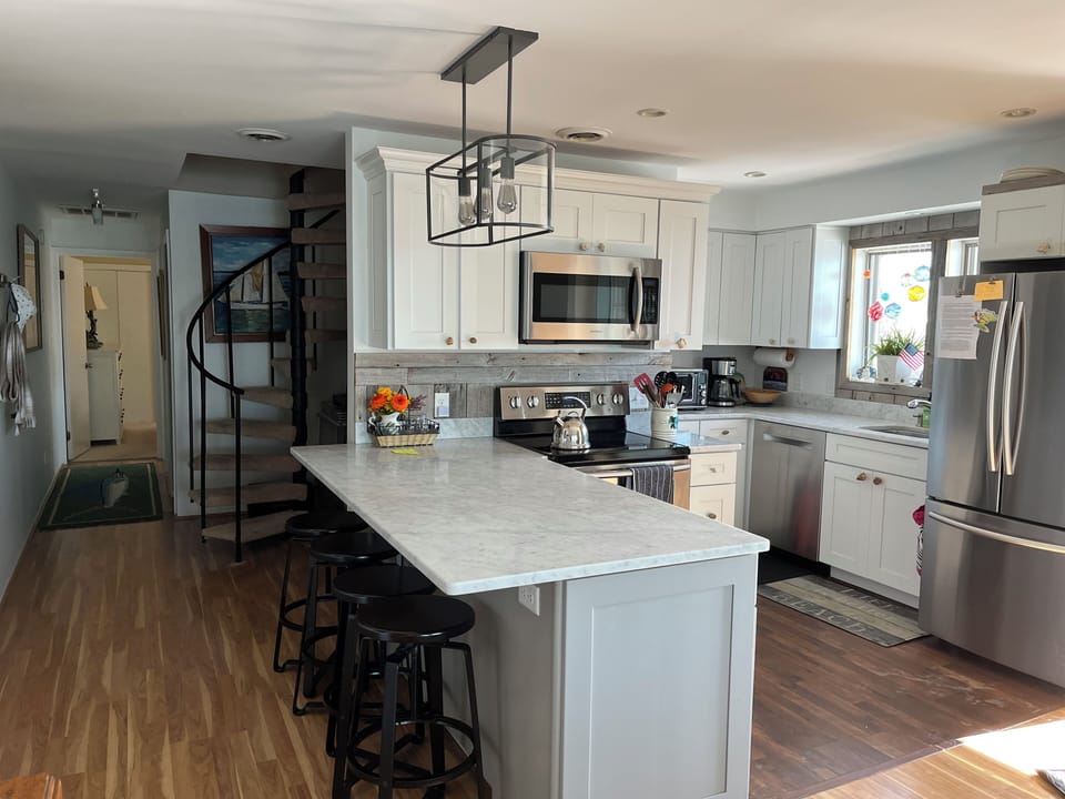 kitchen area hall to 2 bedrooms and 1.5 baths  Stairway to Main bedroom and full