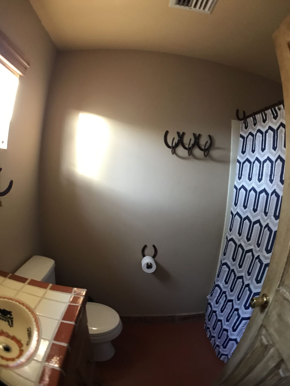 A full tub and shower complete this bathroom.