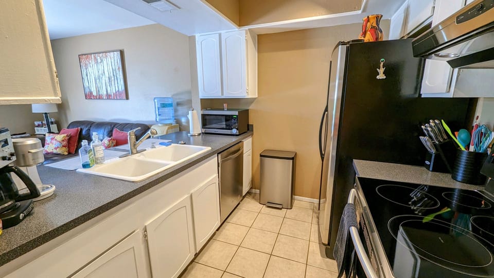 Kitchen has everything you'd want with more items in the laundry room.