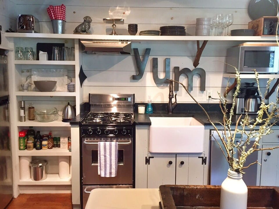 A compact kitchen has everything you need to cook and serve a gourmet meal...