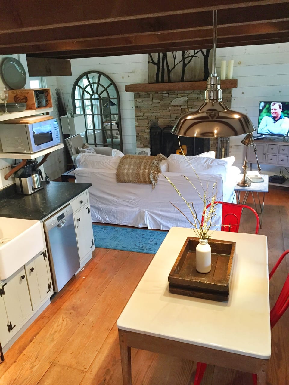 Open concept...porcelain-topped table grounds the kitchen and prep area...