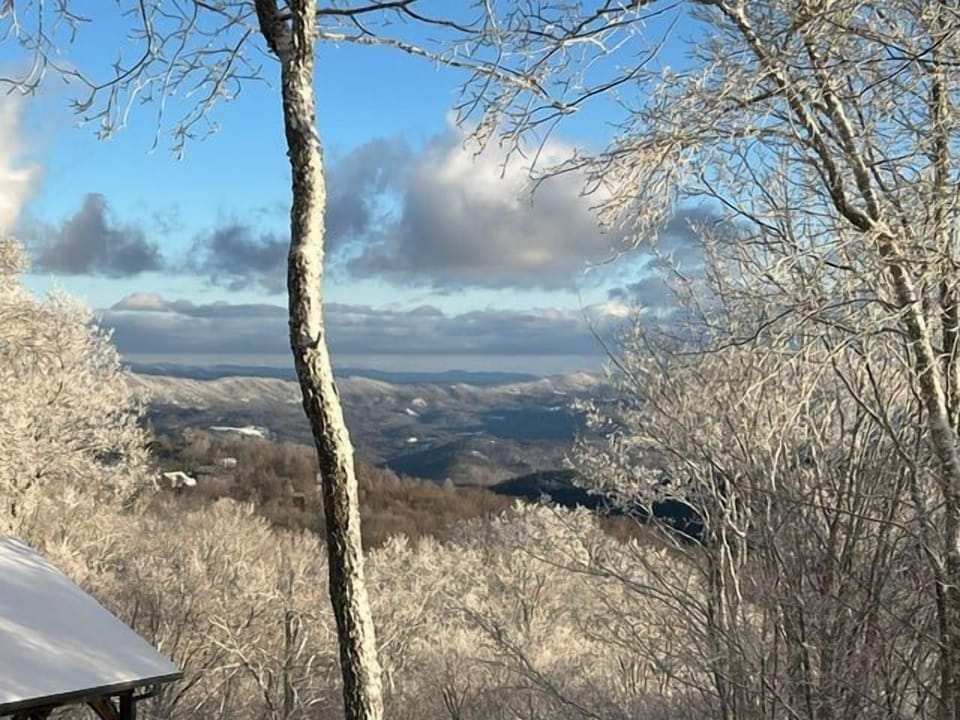 Snow-covered trees and long-range winter views from Beech Mountain