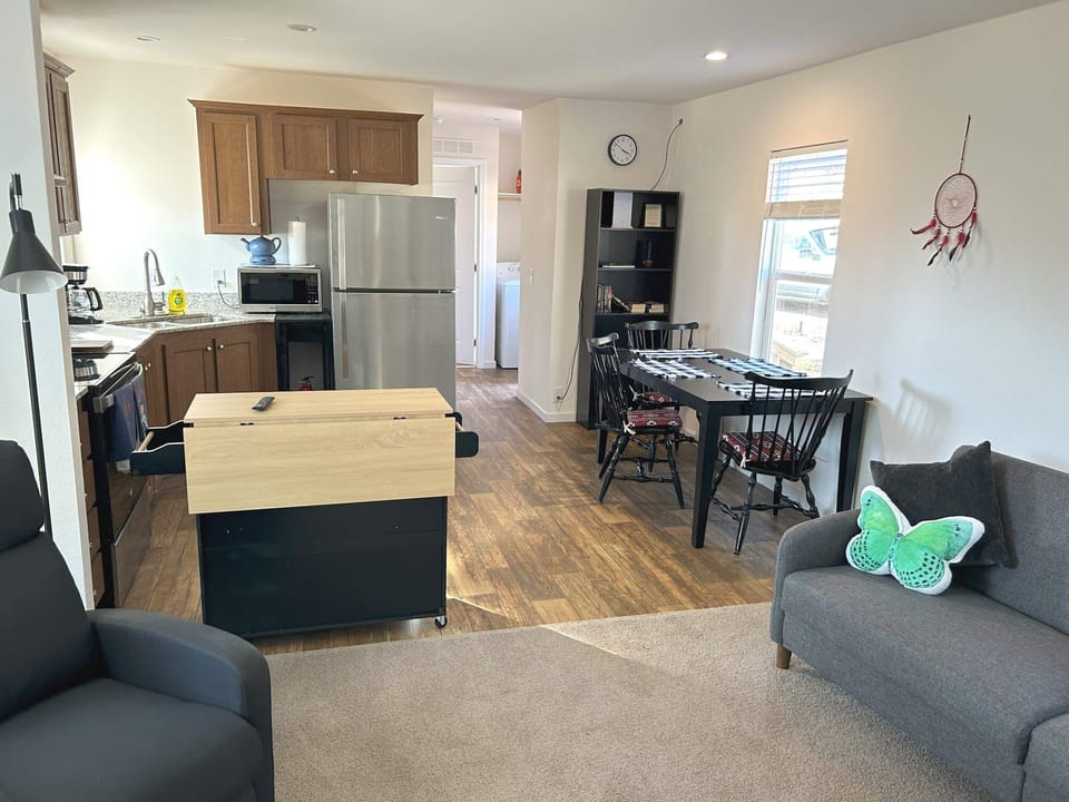 Living dining kitchen area with full size appliances, utensils, pots, pans, etc.
