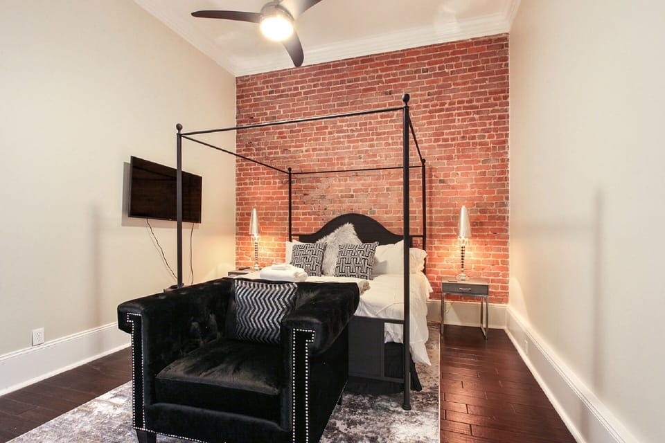 High ceiling luxury king bed with mounted tv