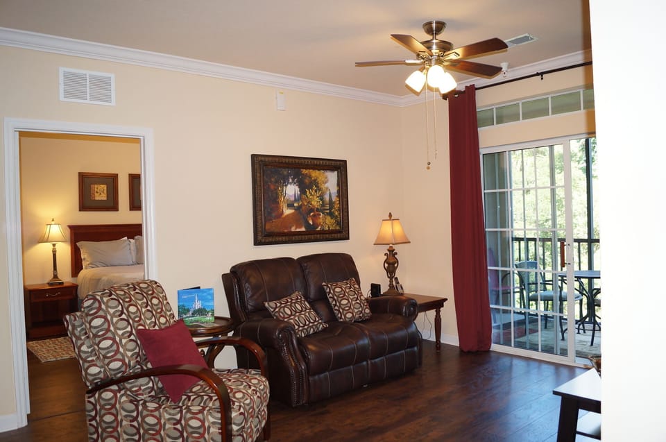 Family room with view into bedroom #2 and attached small screened porch.