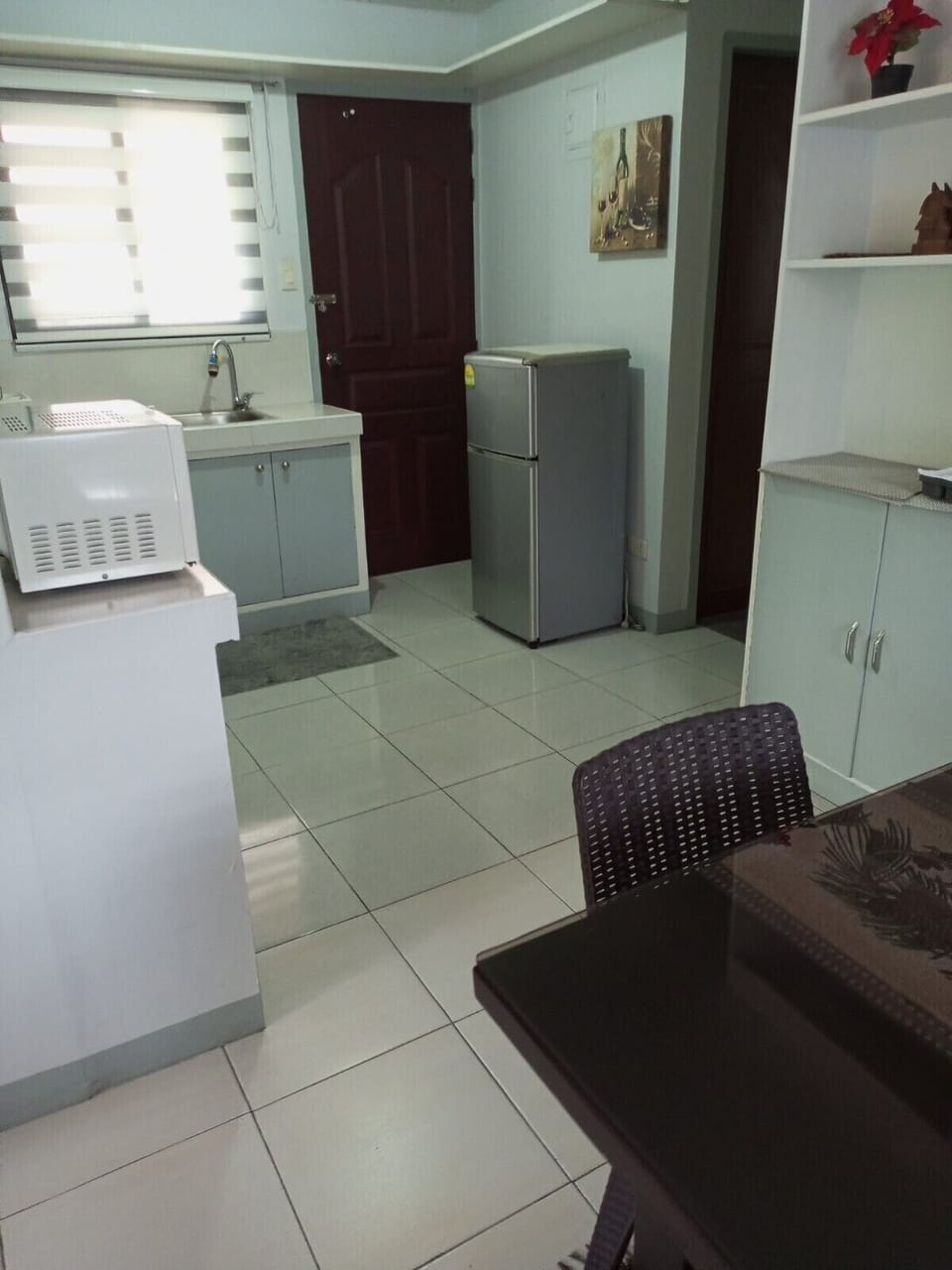 Door leads to a private veranda off the kitchen, has washing sink & garbage bin.