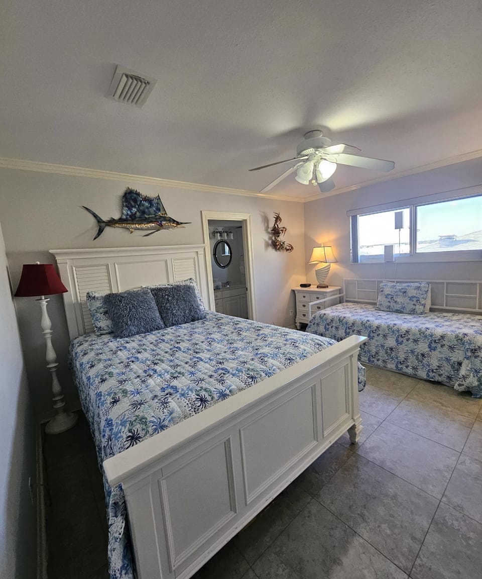 The second bedroom offers both a queen size bed and a daybed with trundle