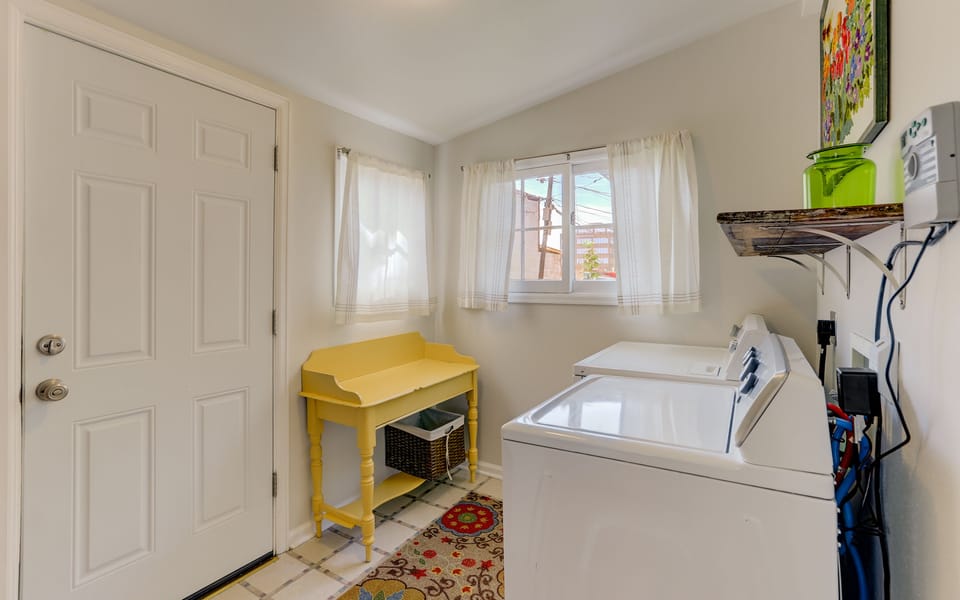 Washer and dryer in separate laundry room.
