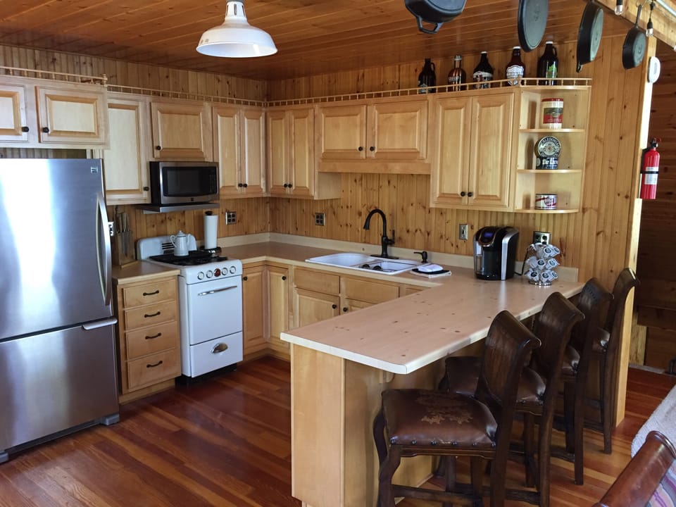 Kitchen area with bar seating for 4